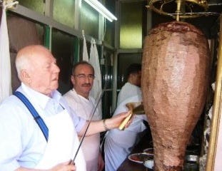 Man slicing up a kebab